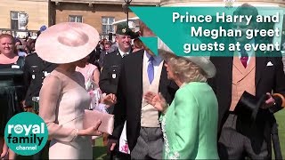 Prince Harry and Meghan greet guests at Prince Charles' 70th birthday