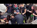 USA: Police officer kneels to hug protester at California rally