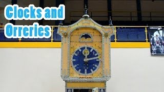 Model clocks and orreries shown at the world