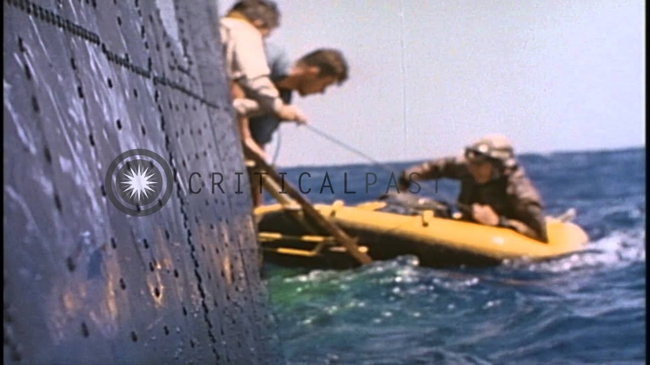 A pilot comes aboard PBM Mariner during air sea rescue work in the