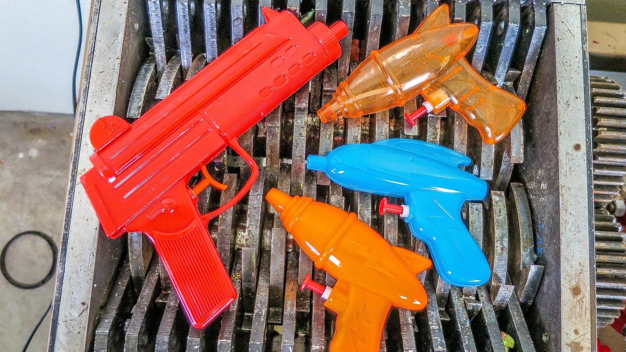 SHREDDING WATER GUNS!  DESTROYED AND RECYCLED TOYS!