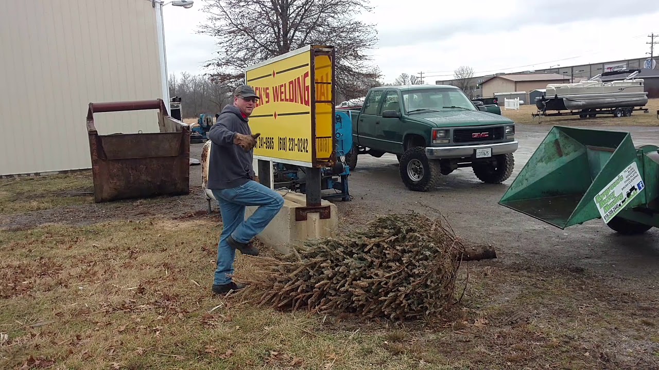 Sending our Christmas tree through our new wood chipper YouTube