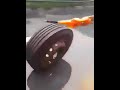 Car accident: catching a rolling wheel on highway.