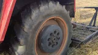 Homemade rotary cutter cutting a driveway through a field