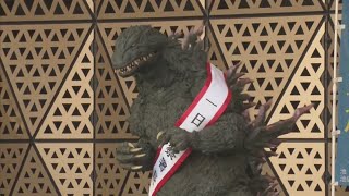 Godzilla stomps through Tokyo streets teaching traffic safety
