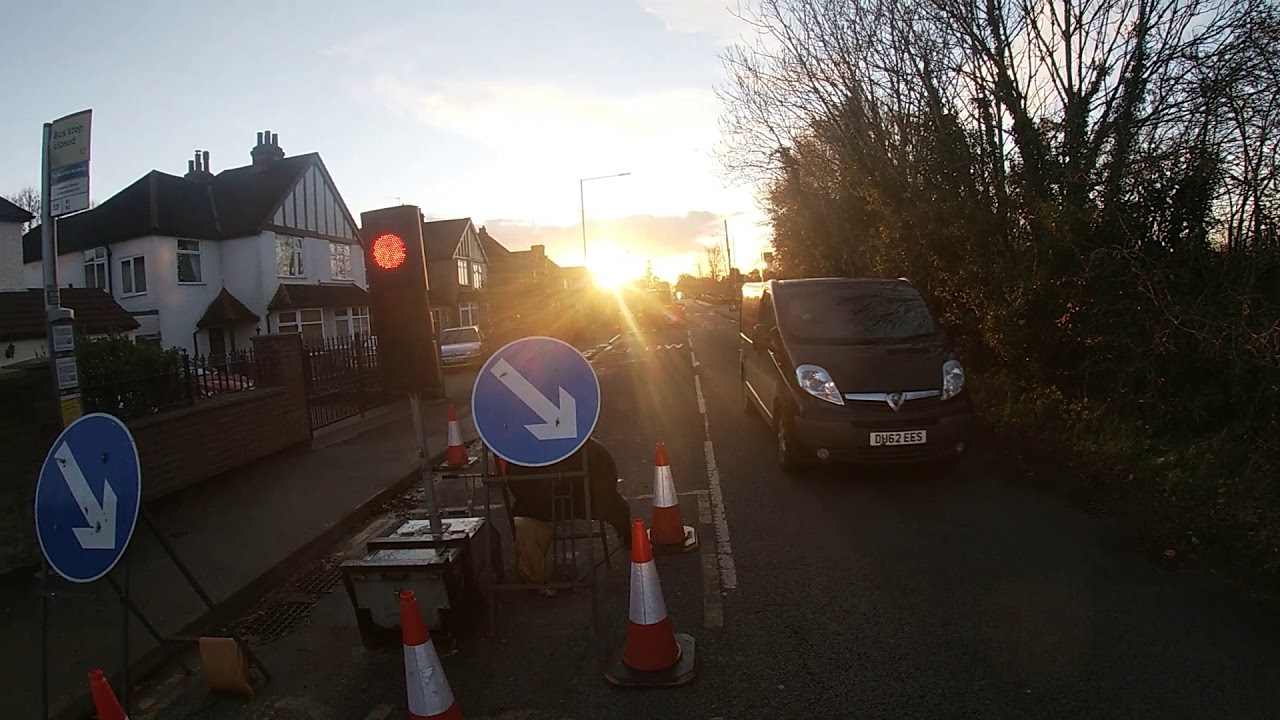 cyclist karma after running red light, nearly gets hit - YouTube