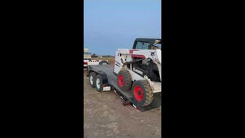 Loading Bobcat on a tilt trailer