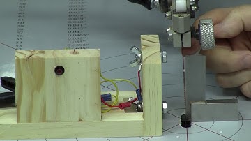 Scroll saw blade alignment for the visually impaired.