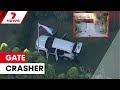 Man crashes car through Russian consulate gates | 7NEWS