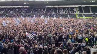 Derby fans with their chant towards rivals Forest after promotion yesterday
