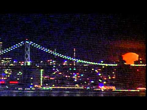 The moon setting over San Francisco