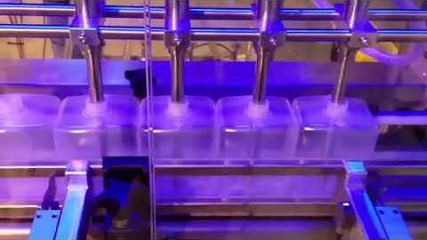 SP8000 multihead liquid filler bottom up filling