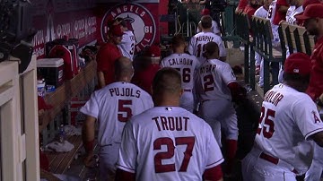 OAK@LAA: Pujols chases after Aybar in the dugout