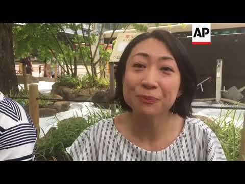 Residents of Tokyo struggle to stay cool as heatwave scorches city