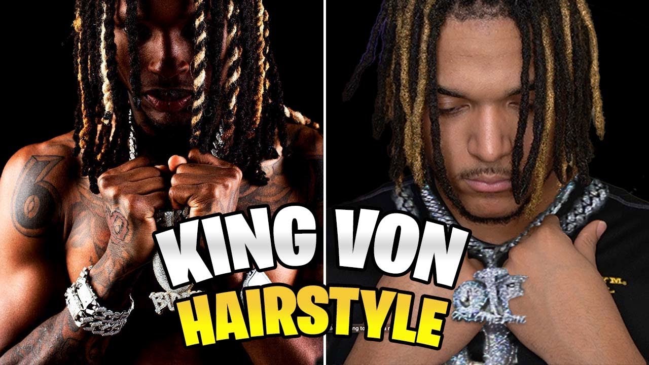 King Von With Twisted Hair And Tattoos On Hand And Neck Is Wearing
