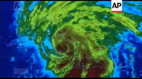 Hurricane Sandy pounded Jamaica with heavy rain and a powerful storm surge as it headed for landfall