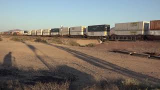 EBD BNSF Stack train passes WBD stack waiting for signal @ Daggett, CA 5/11/21.