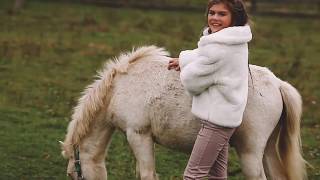 A Young Model The Farm With Sheeps And Pony