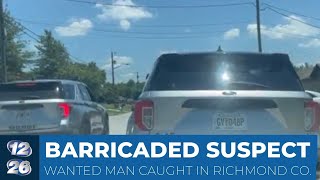 Wanted suspect arrested after barricading inside Augusta home