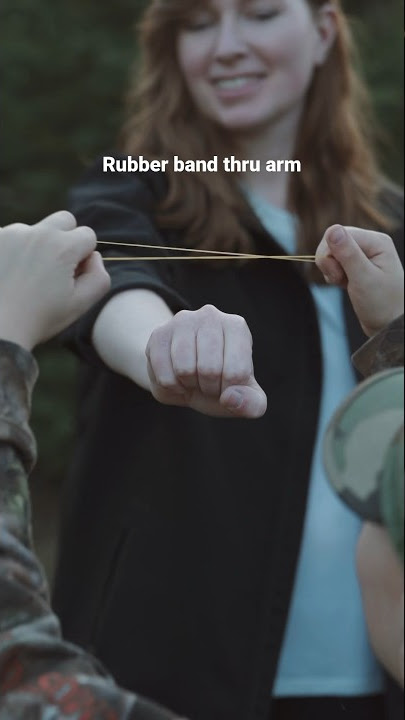 Rubber band passing through arm #magic