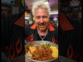 Guy Fieri eating pig slop buckets