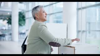 Vote pin, ballot and mature woman at booth, USA and democracy