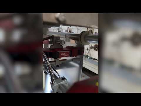SNEED-JET® Titan Thermal Inkjet Printer Installed on Vertical Form Fill Machine With Encoder