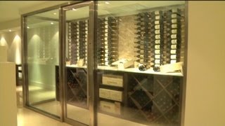 Private wine rooms not only provide optimal climate for storing precious bottles but they can become focal points of luxury home 