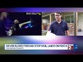 Driver blows through stop sign in Dickson County, lands on porch
