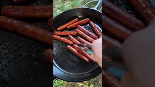 Hotdogs cooked outdoors…in a huge cast iron skillet