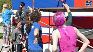 Painting the Town Red, White & Blue: Minooka Junior High Unveils Patriotic Mural in Downtown Minooka