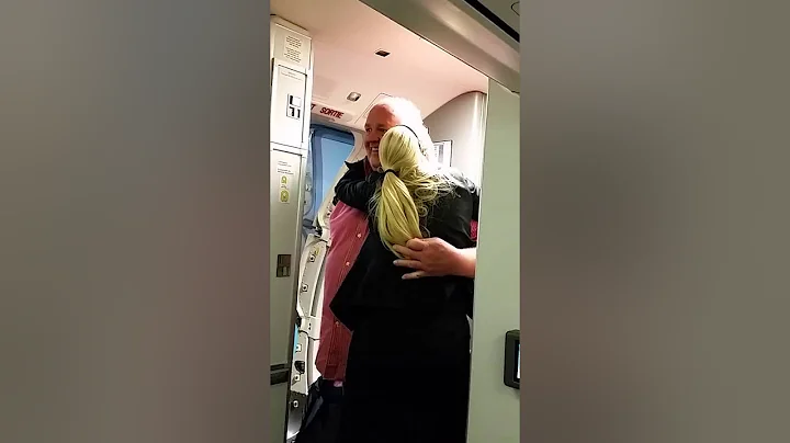 West Jet flight attendant hugs all the passengers