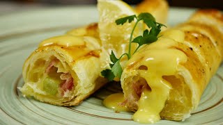 Asparagus in French pastry crust with Prosciutto and cheese, topped with Hollandaise!