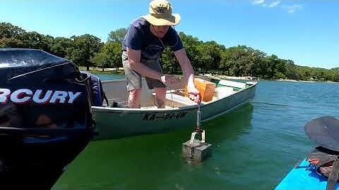 Using an Eckman dredge to sample lake sediments