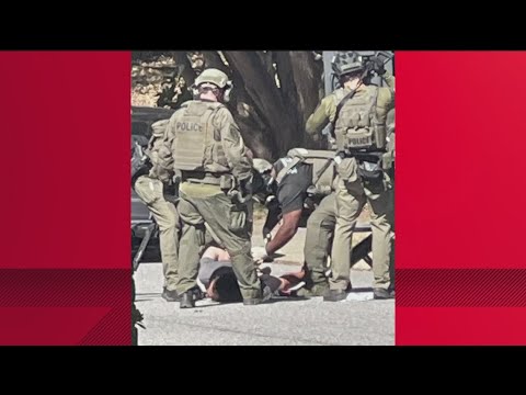Sandy Springs officer shot, suspect under arrest after SWAT standoff ...