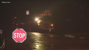Crews work to clear downed trees following storms