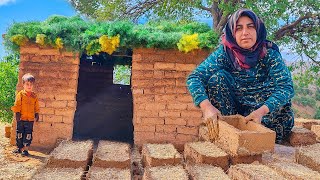 Building a very beautiful mud hut in the mountains by a village woman