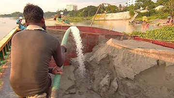 River Sand Mining: Sand Dredging and Barge Unloading in Action