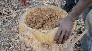 Chipping a single piece of wood to become a Djembe