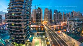 An Aerial view of Dubai Marina Towers in Dubai day to night timelapse