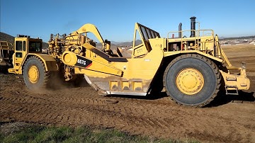 CAT 657B and 657G scrapers in action