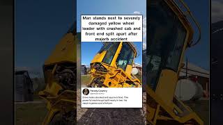 Man stands next to severely damaged yellow wheel loader with crushed cab and front end #shorts