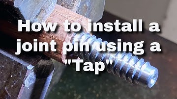 How to install a joint pin in a pool cue using a tap