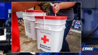 Red Cross handing out cleaning supplies after flash floods