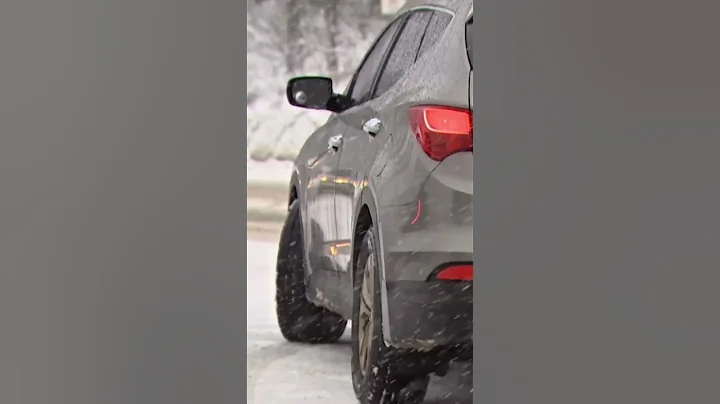 Snow falls on Snoqualmie Pass as holiday travelers push through