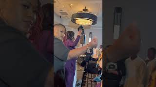 Dr. Cindy Trimm tossing mantles and laying hands!