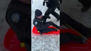 Police officer crashes into child while sledding
