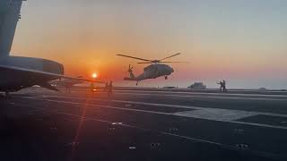 Navy Mh-60S Helicopter Landing On A Aircraft Carrier