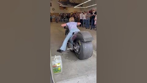 Girl burnout on her drag bike