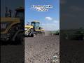 Cat 95E Challenger Tractor pulling a John Deere field cultivator in Illinois